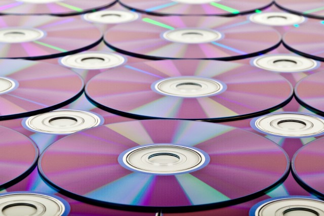 multiple music CDs demonstrating copyright ownership